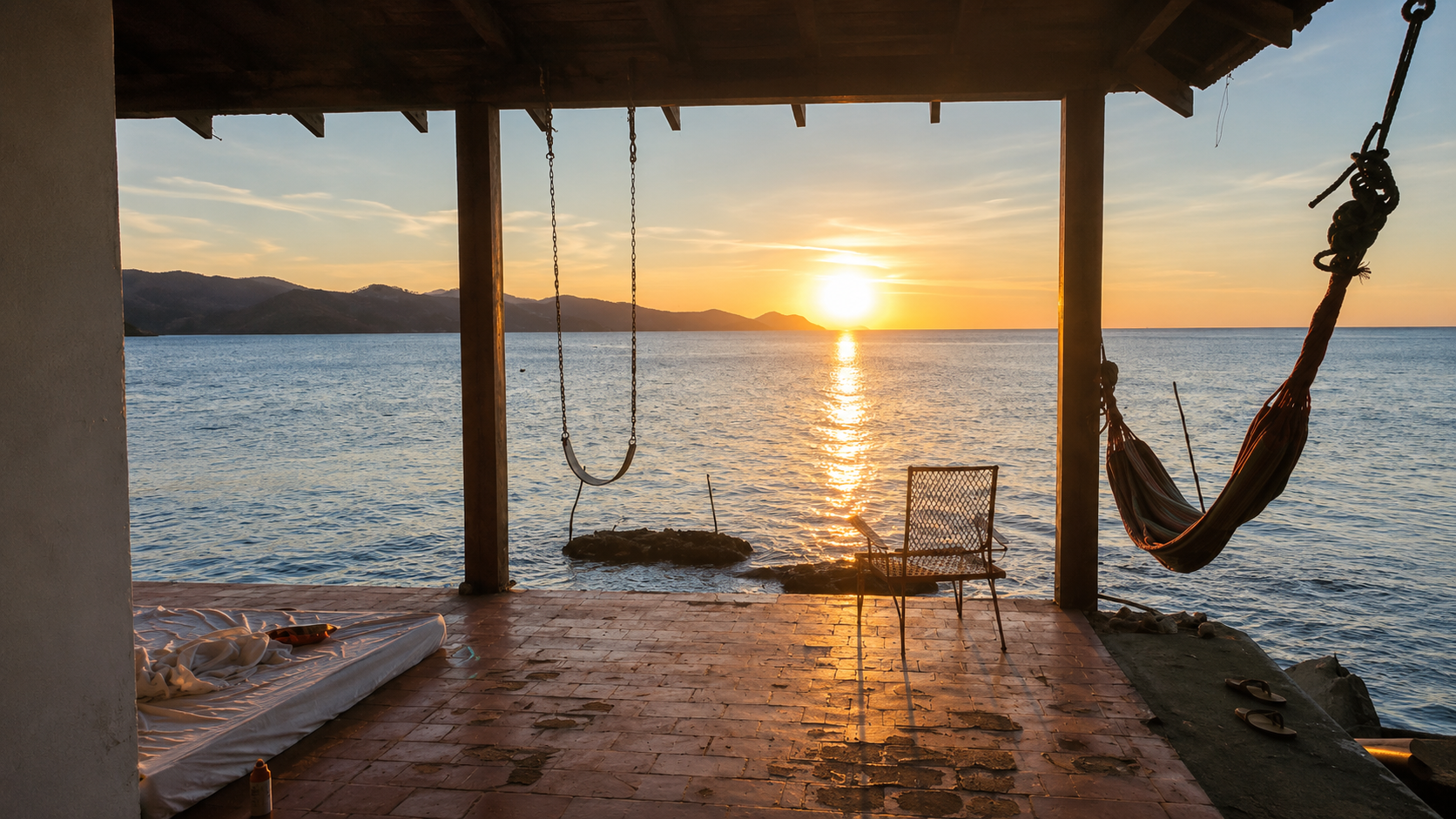 Sunset over the ocean from a hammock porch