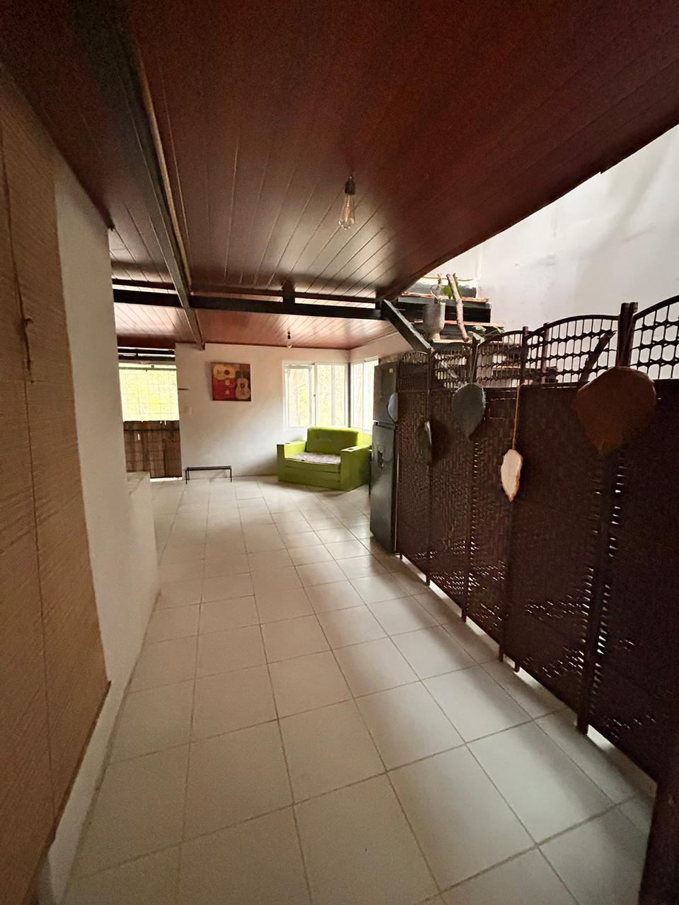 Common area with sofa and tropical decor